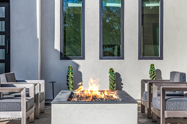 exterior details with a fire pit