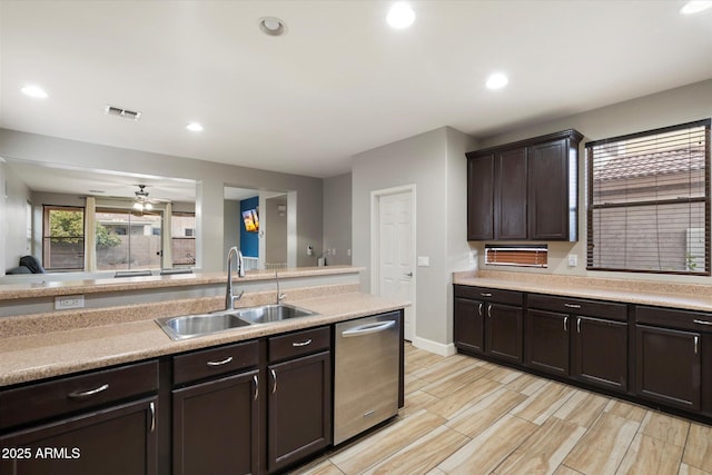 kitchen featuring ceiling fan, stainless steel dishwasher, sink, and dark brown cabinets