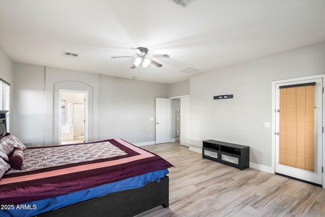 bedroom with ceiling fan, connected bathroom, and light wood-type flooring