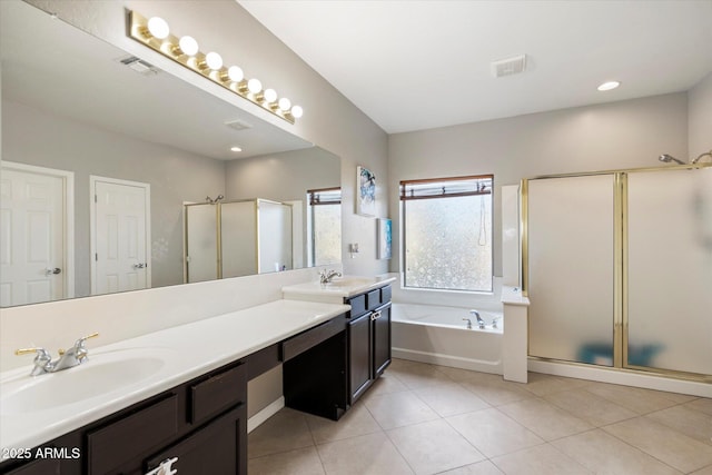 bathroom with independent shower and bath, vanity, and tile patterned floors