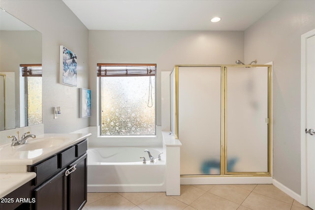 bathroom featuring vanity, tile patterned floors, and shower with separate bathtub