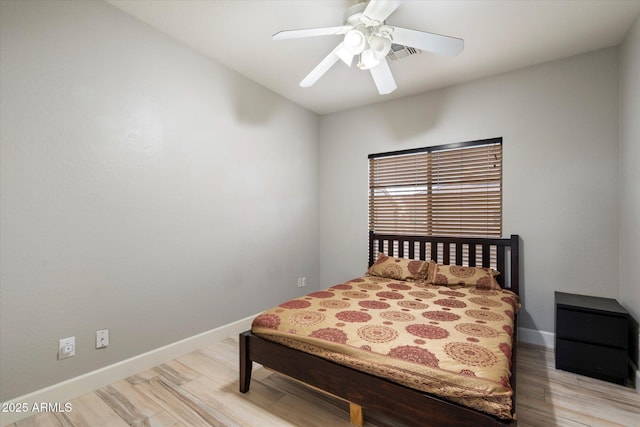 bedroom featuring light hardwood / wood-style floors and ceiling fan