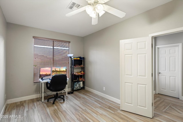 home office with ceiling fan, lofted ceiling, and light hardwood / wood-style floors