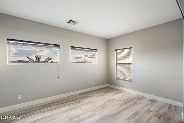 unfurnished room featuring light hardwood / wood-style flooring