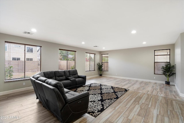 living room with light hardwood / wood-style flooring