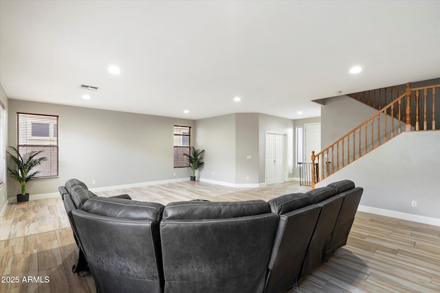 living room with light hardwood / wood-style flooring