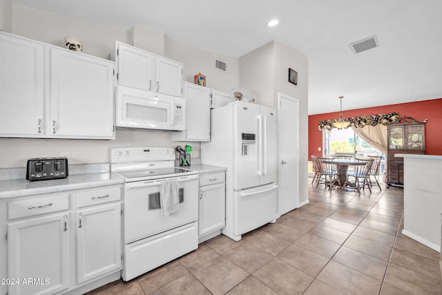 kitchen with white cabinets, pendant lighting, white appliances, and light tile patterned flooring