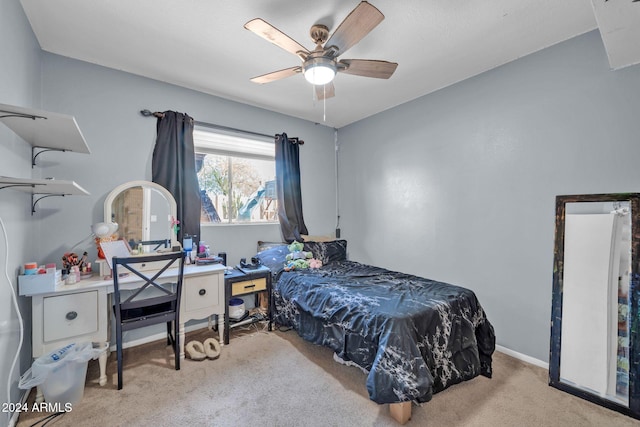 carpeted bedroom featuring ceiling fan