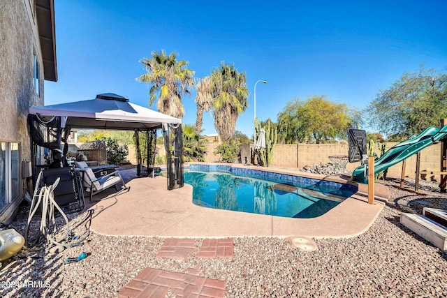 view of pool featuring a gazebo and a patio