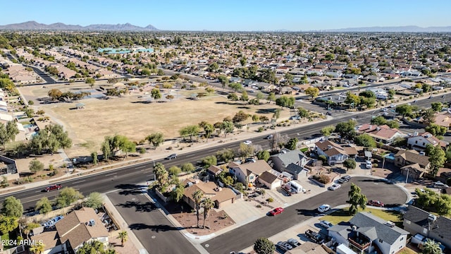 birds eye view of property with a mountain view