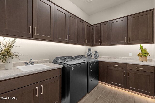 kitchen featuring crown molding, backsplash, dark brown cabinets, light stone counters, and light wood-type flooring