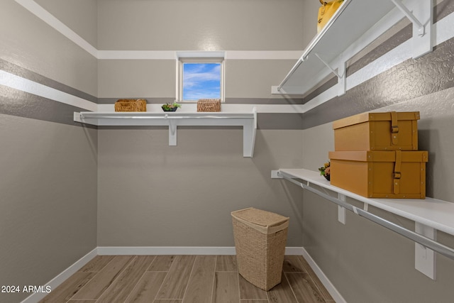 spacious closet featuring wood tiled floor