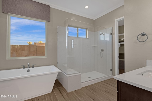 bathroom with a shower stall, ornamental molding, and wood finished floors