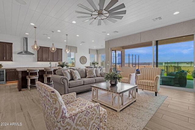 patio terrace at dusk with ceiling fan and an outdoor hangout area