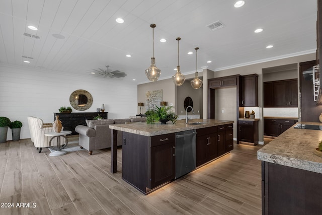 kitchen featuring a sink, black electric stovetop, visible vents, and dishwasher