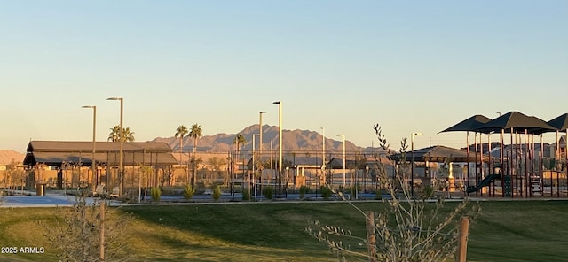 playground at dusk with a lawn