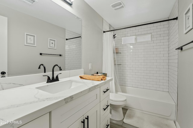 full bathroom featuring vanity, toilet, and shower / tub combo with curtain