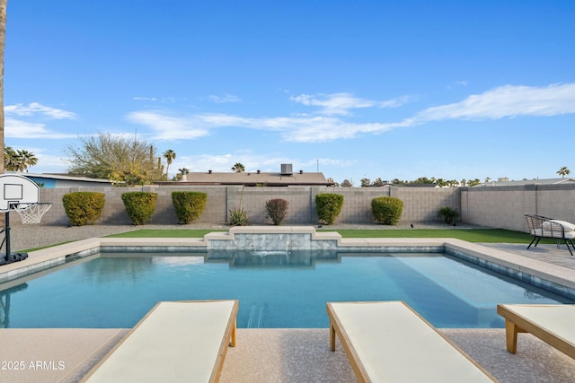 view of swimming pool featuring a diving board