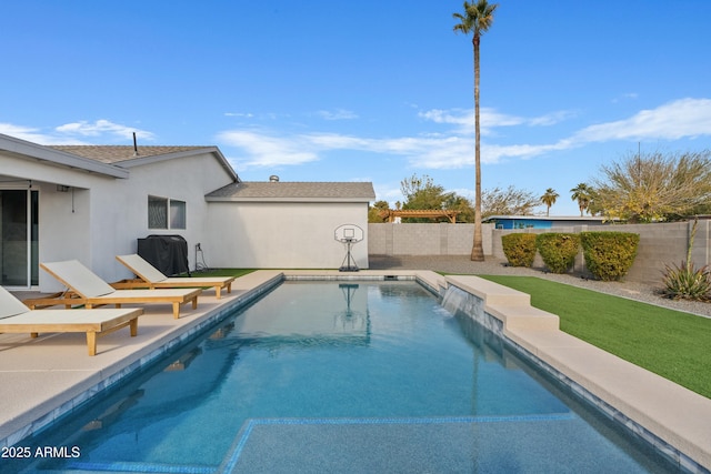 view of swimming pool with area for grilling, a fenced backyard, and a fenced in pool