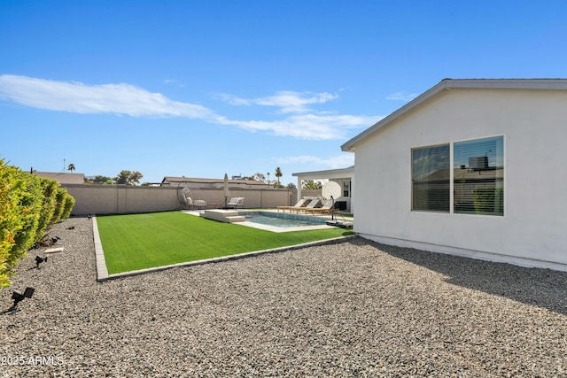 view of yard featuring a fenced in pool, a fenced backyard, and a patio