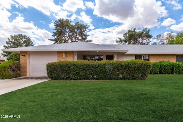 ranch-style home featuring a garage, a front lawn, concrete driveway, and brick siding