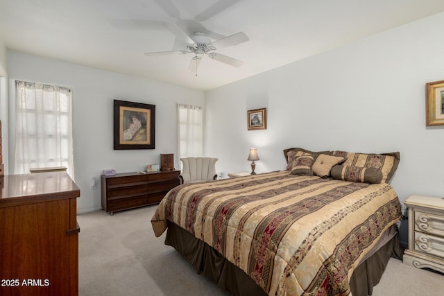 bedroom featuring ceiling fan and light carpet