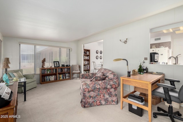 carpeted living area featuring visible vents