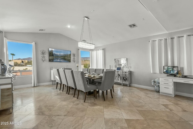 dining space with lofted ceiling