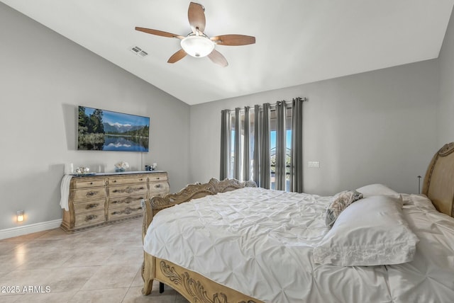 bedroom with light tile patterned floors, vaulted ceiling, and ceiling fan