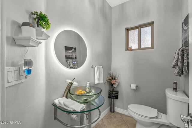 bathroom featuring tile patterned flooring and toilet