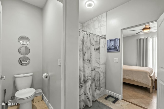 bathroom with tile patterned floors, a shower with curtain, ceiling fan, and toilet