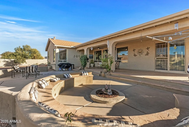 view of patio featuring ceiling fan