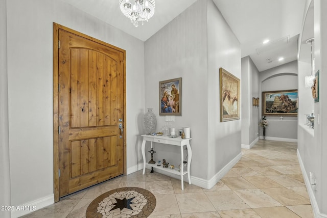 foyer entrance featuring a chandelier