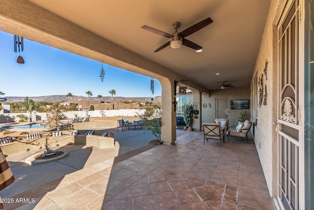 view of patio with ceiling fan