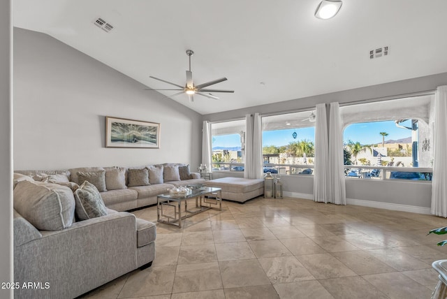 living room featuring ceiling fan and lofted ceiling