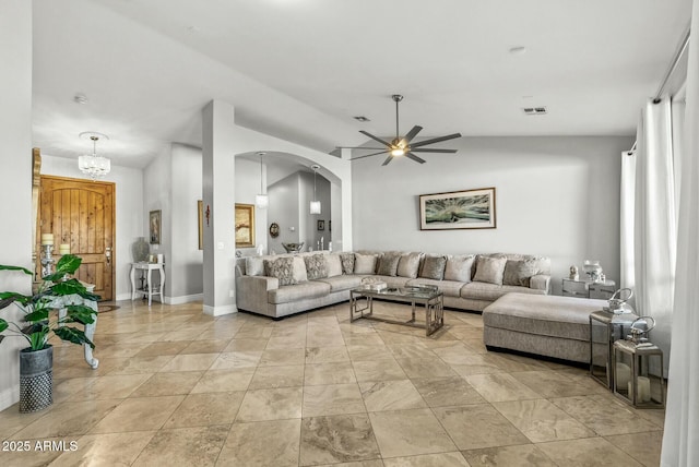 living room with ceiling fan and vaulted ceiling