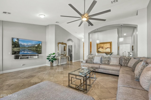 living room with ceiling fan and lofted ceiling