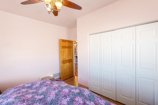 unfurnished bedroom with a closet, visible vents, and ceiling fan