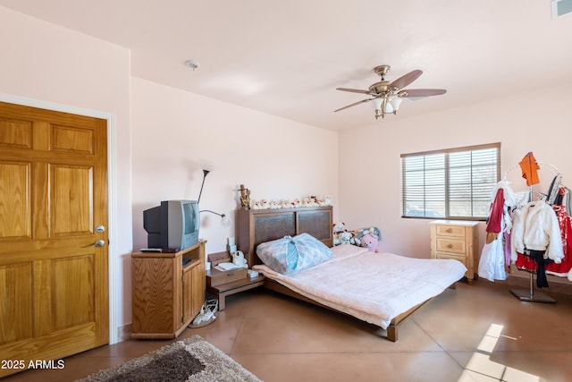 tiled bedroom with visible vents and ceiling fan