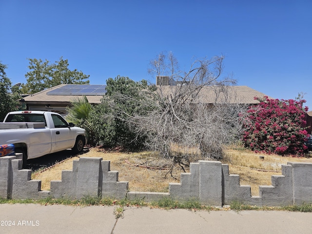 view of front of property with solar panels