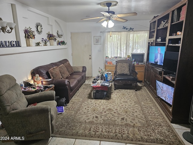 living room featuring ceiling fan and light tile patterned floors