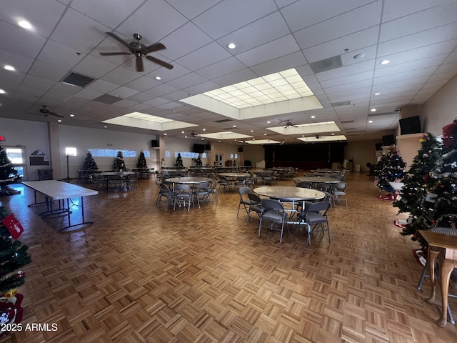 interior space featuring parquet floors and ceiling fan