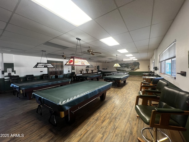 playroom with hardwood / wood-style flooring, pool table, and a drop ceiling