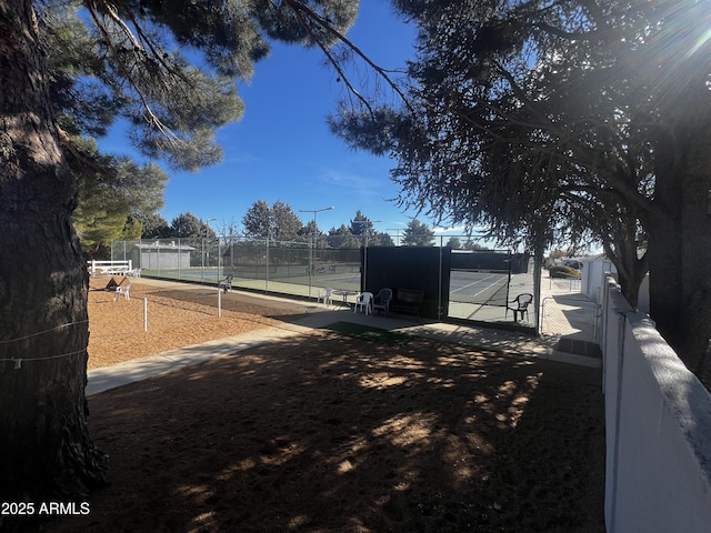 view of yard with tennis court