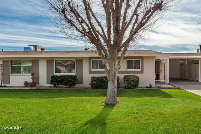 ranch-style house with a carport and a front yard