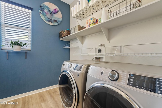 5725 S 101st St, Mesa, AZ 85212 - clothes washing area with light wood-style flooring, baseboards, washer and clothes dryer, and laundry area