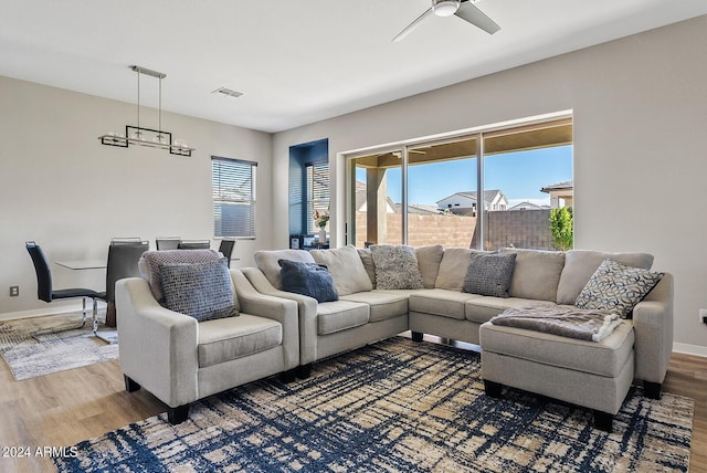 5725 S 101st St, Mesa, AZ 85212 - living area featuring baseboards, light wood-style flooring, visible vents, and a ceiling fan