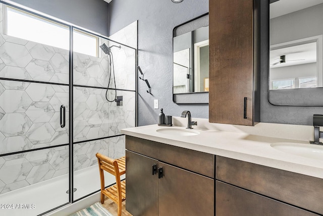 5725 S 101st St, Mesa, AZ 85212 - full bathroom featuring a shower stall, a textured wall, a sink, and double vanity