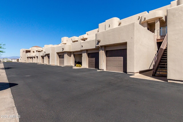 16626 E Westby Dr Unit 108, Fountain Hills, AZ 85268 - view of building exterior with stairs and community garages