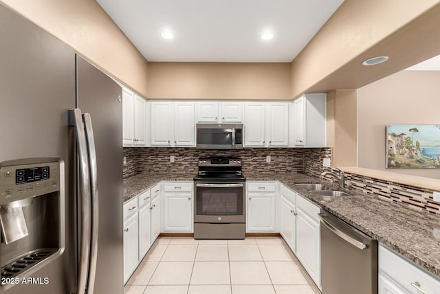 16626 E Westby Dr Unit 108, Fountain Hills, AZ 85268 - kitchen with appliances with stainless steel finishes, light tile patterned floors, backsplash, a sink, and recessed lighting
